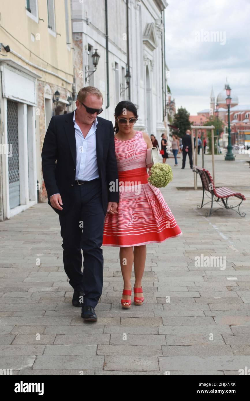 Salma Hayek and her husband Francois-Henri Pinault walk hand in hand while out in Venice, Italy, September 1 2012 Stock Photo