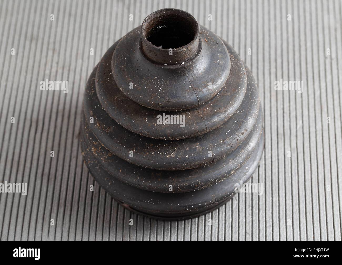Old CV joint boot providing protection and dirt ingress into the