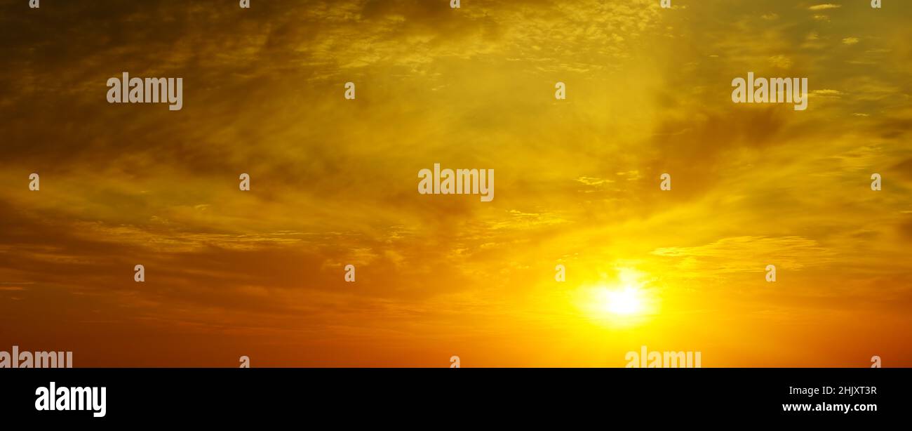 Cloudy sky with golden sunset hi-res stock photography and images - Alamy
