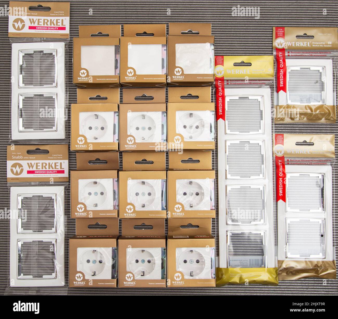 BOBRUISK, BELARUS 22.01.22: Werkel brand electrical kit on a gray background. Set of sockets, switches and frames, close-up Stock Photo