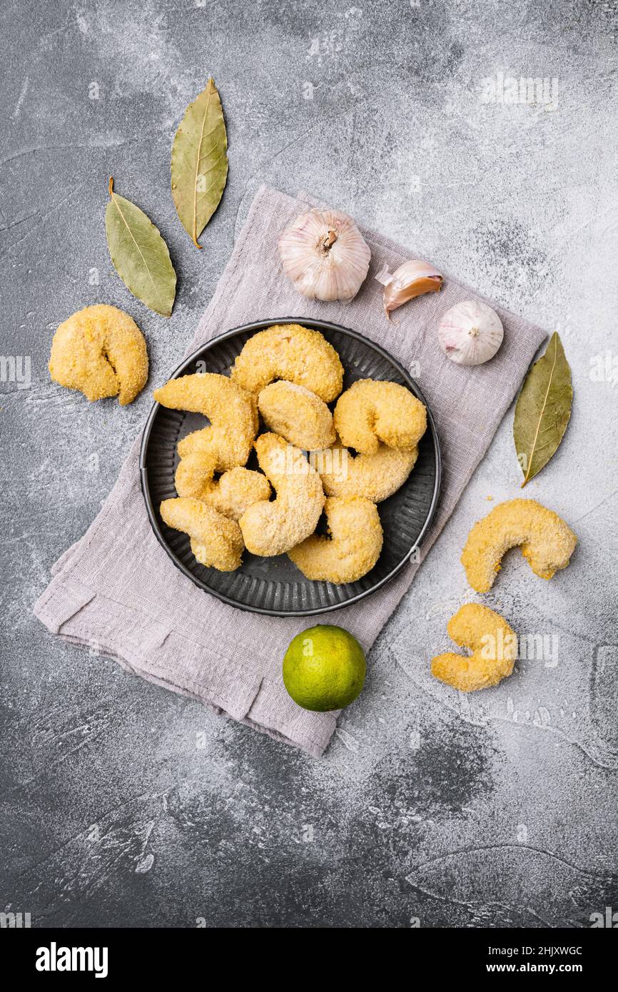 Raw breaded shrimp set, on gray stone table background, top view flat ...