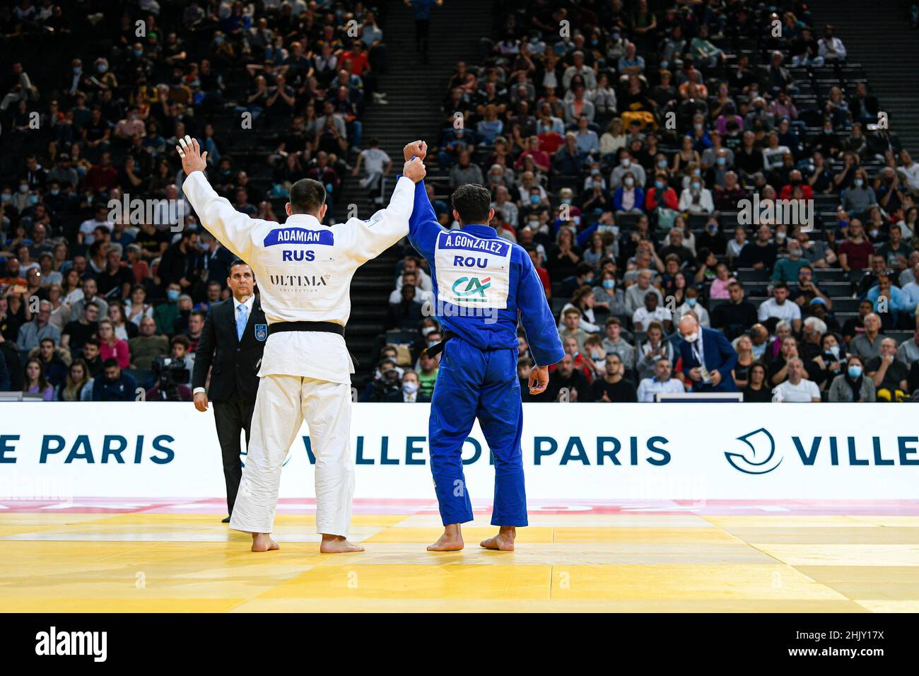 Men -100 kg, Arman ADAMIAN of Russia gold medal competes and Asley GONZALEZ of Romania silver meda salute the audience during the Paris Grand Slam 202 Stock Photo