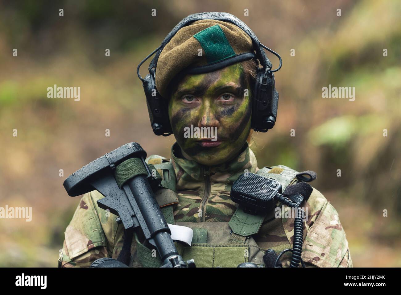 British armed forces lady soldier guarding pose . High quality photo Stock Photo