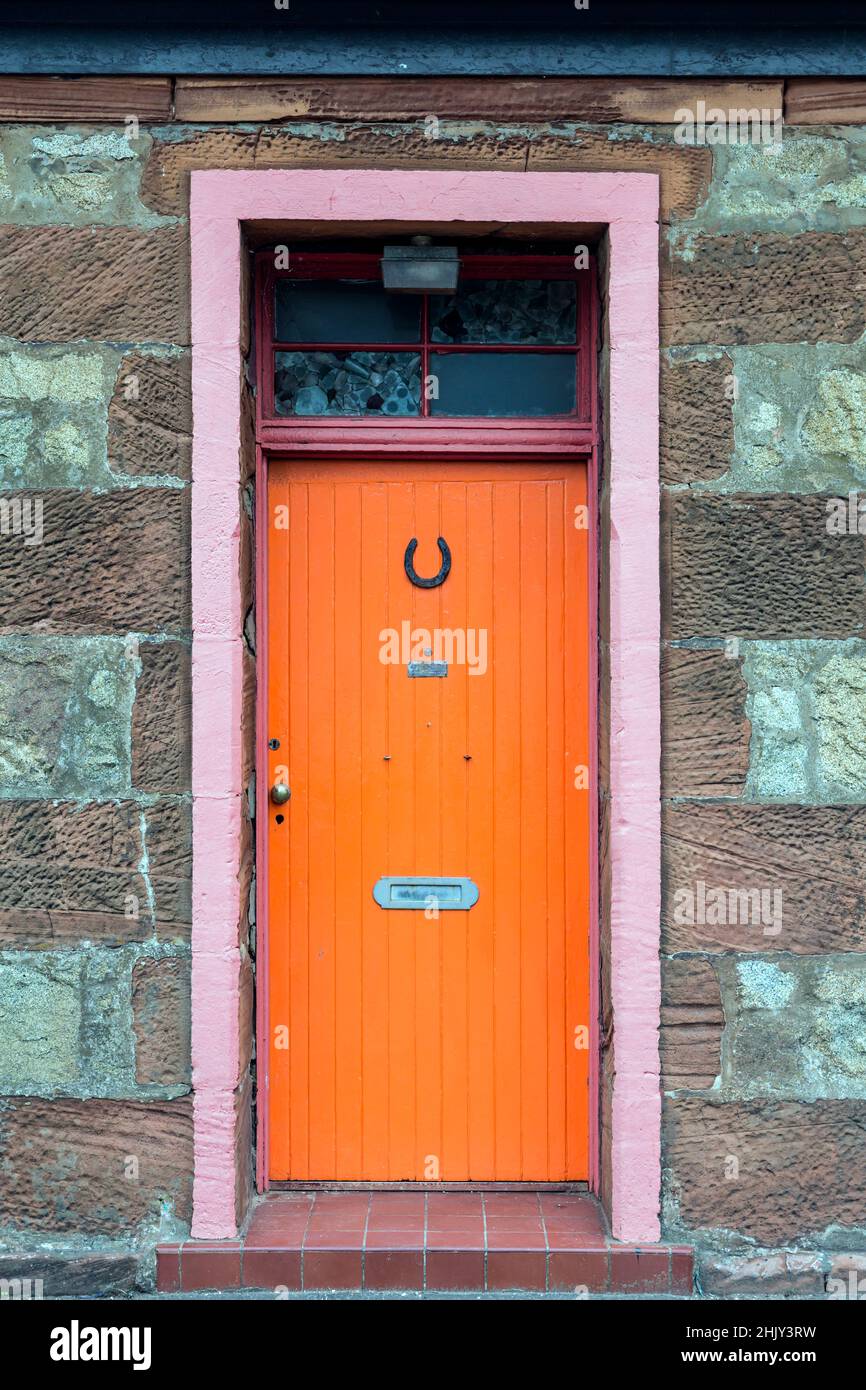 An orange exterior house door, UK Stock Photo