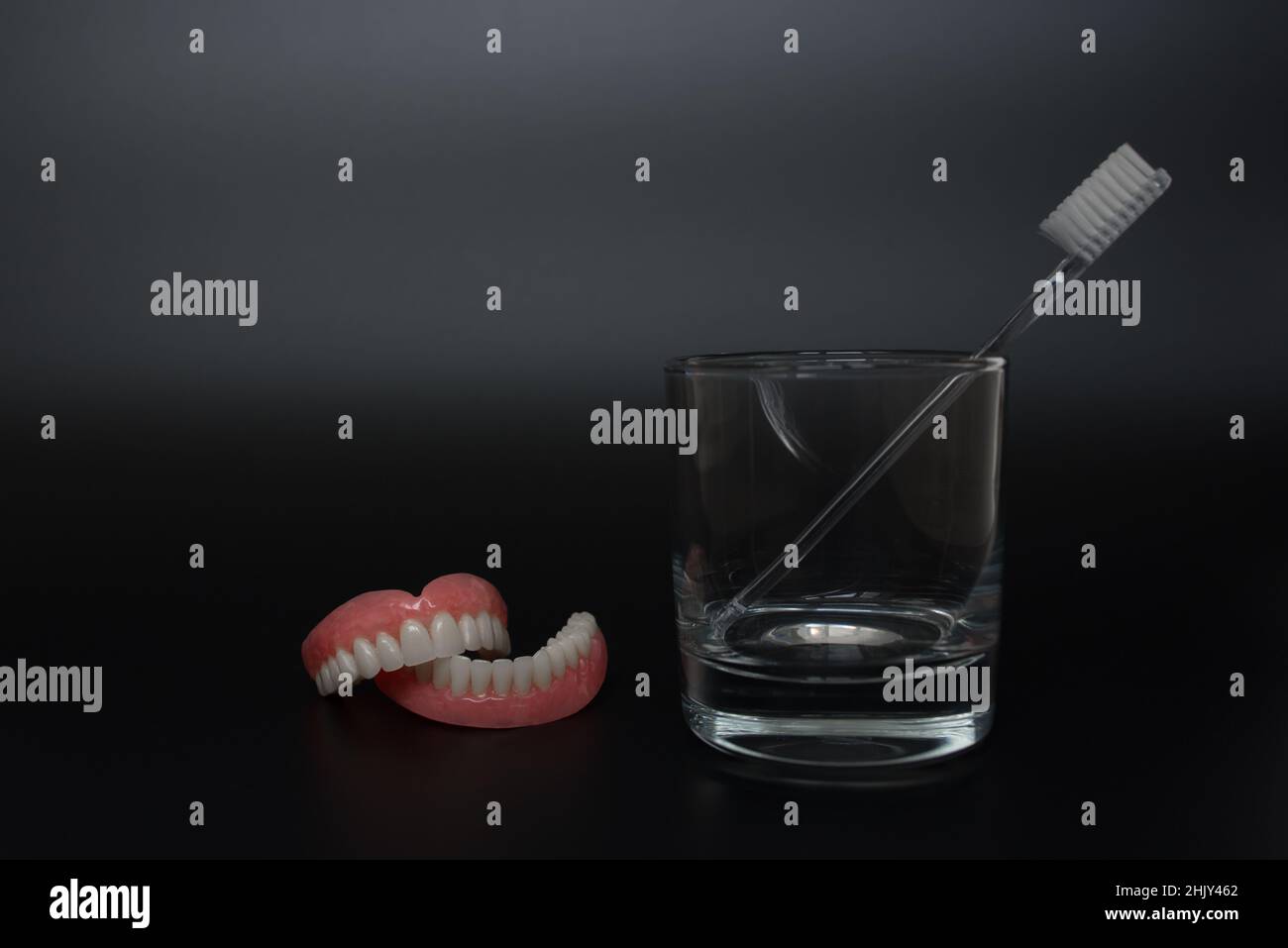 Full removable plastic denture of the jaws. A set of dentures on a