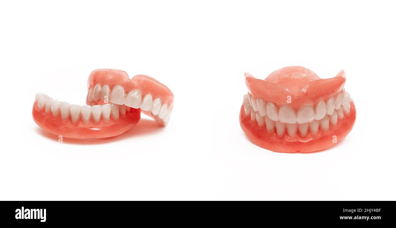 Full removable plastic denture of the jaws. Set of dentures on a white