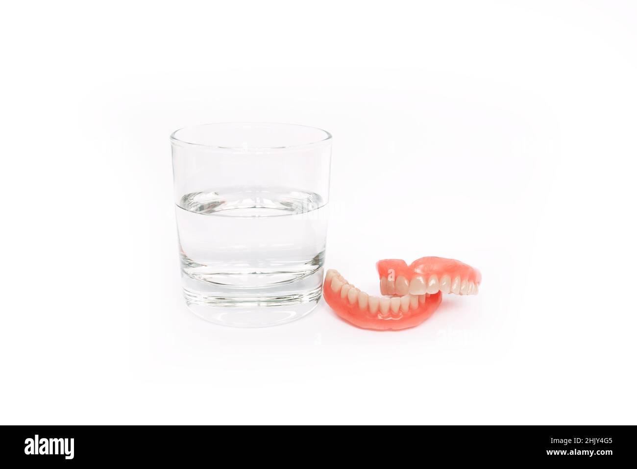 Isolated denture on a white background. Dental prosthesis care. Full