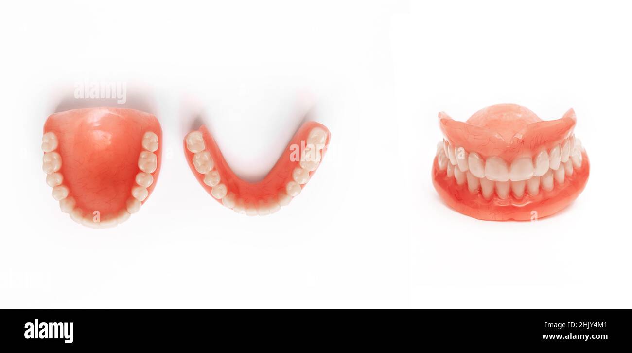 Full removable plastic denture of the jaws. Set of dentures on a white