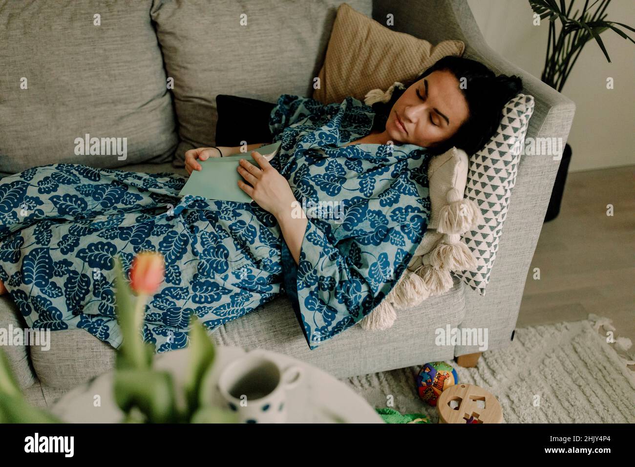 Woman on sofa in living hi-res stock photography and images - Alamy