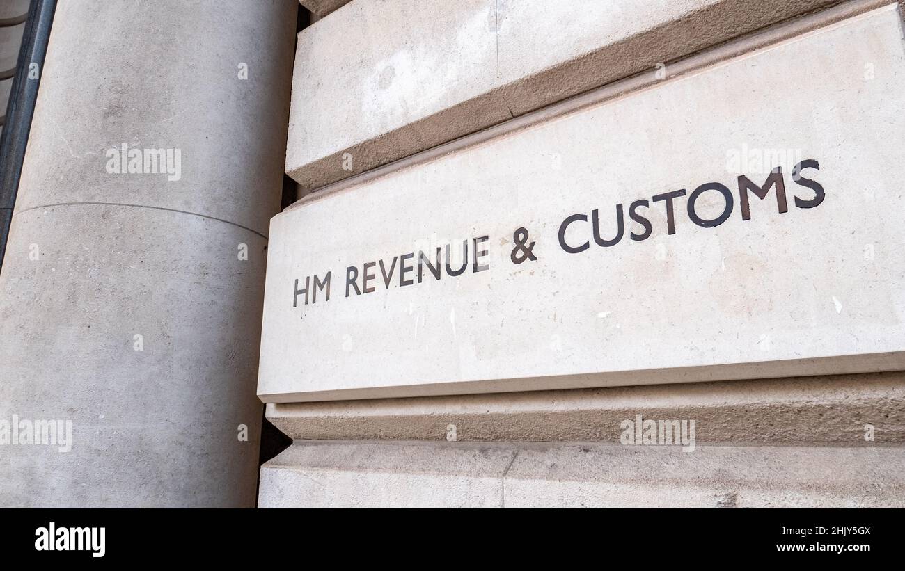HM Revenue & Customs. Signage by the entrance of the UK government tax and customs department more commonly known as the HMRC in Whitehall, London. Stock Photo