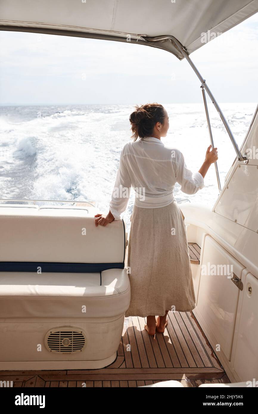 Woman on white yacht in the sea during summer vacation Stock Photo - Alamy