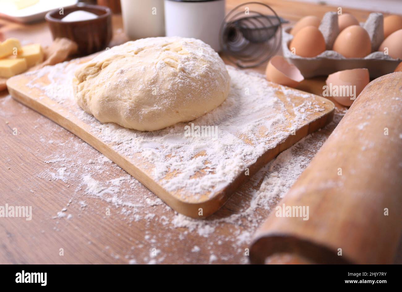 Fresh dough rises into homemade bread Stock Photo