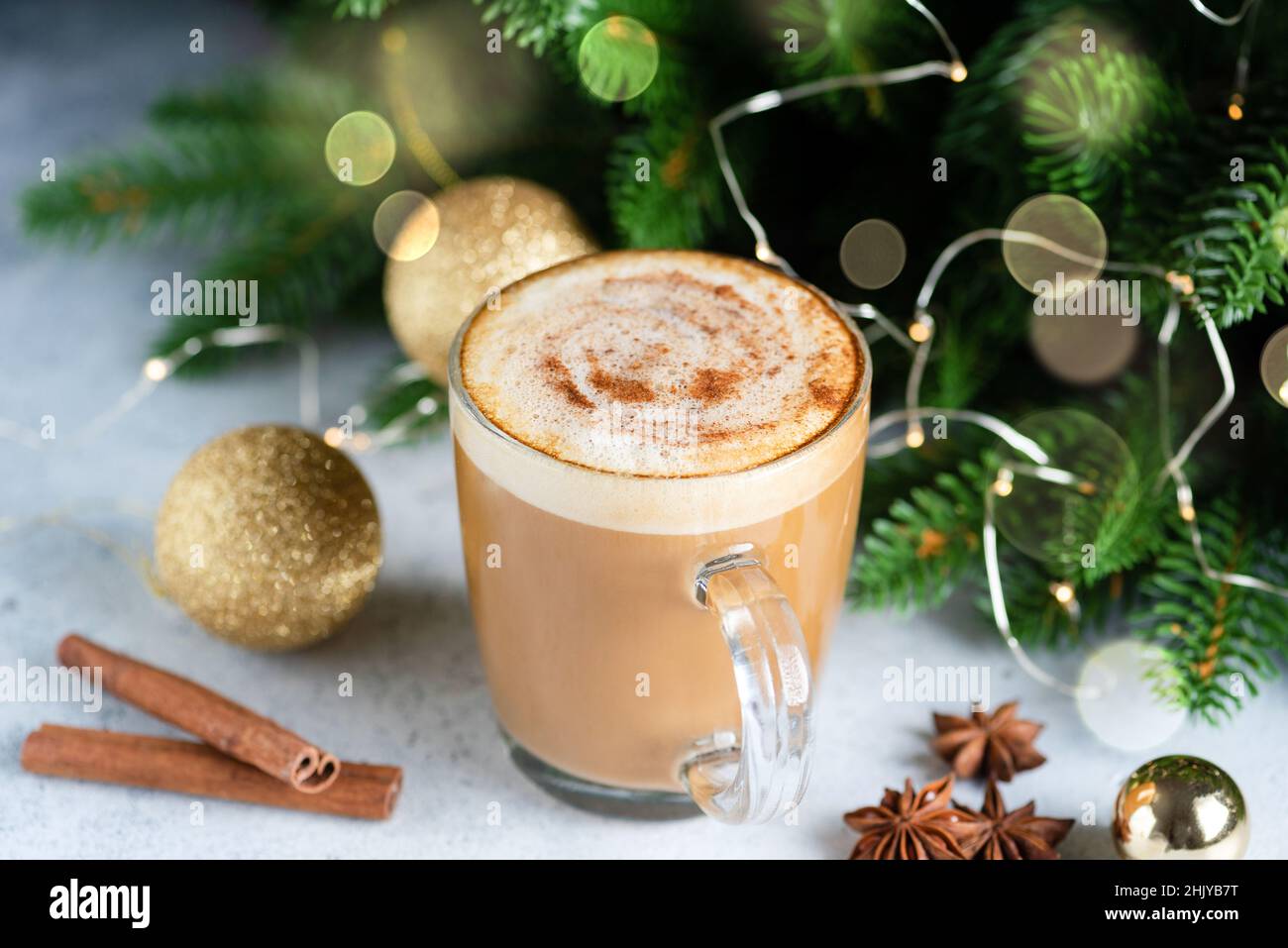Cup of Christmas drink hot eggnog cappuccino with spices. Closeup view Stock Photo