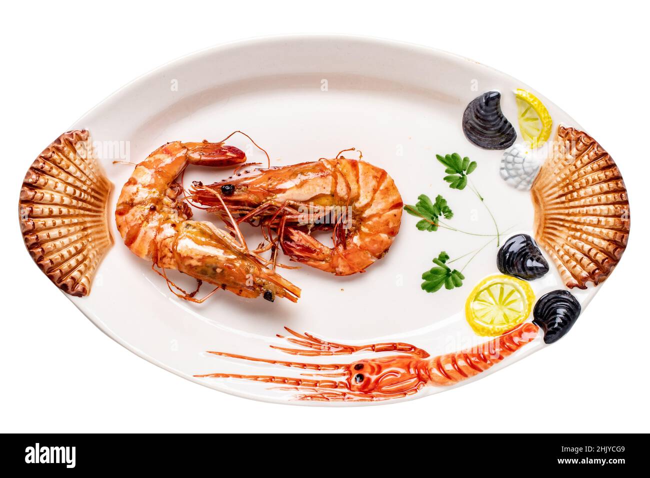 Closeup of fresh grilled large tiger prawns or shrimps on a colourful plate of seafood isolated on a white background. Healthy food concept. BBQ. Clip Stock Photo