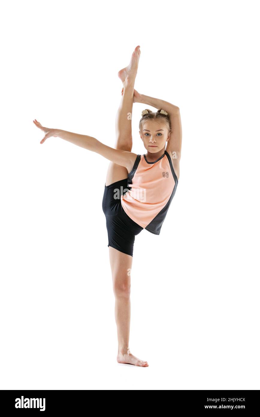 Little flexible girl, rhythmic gymnastics artist isolated on white