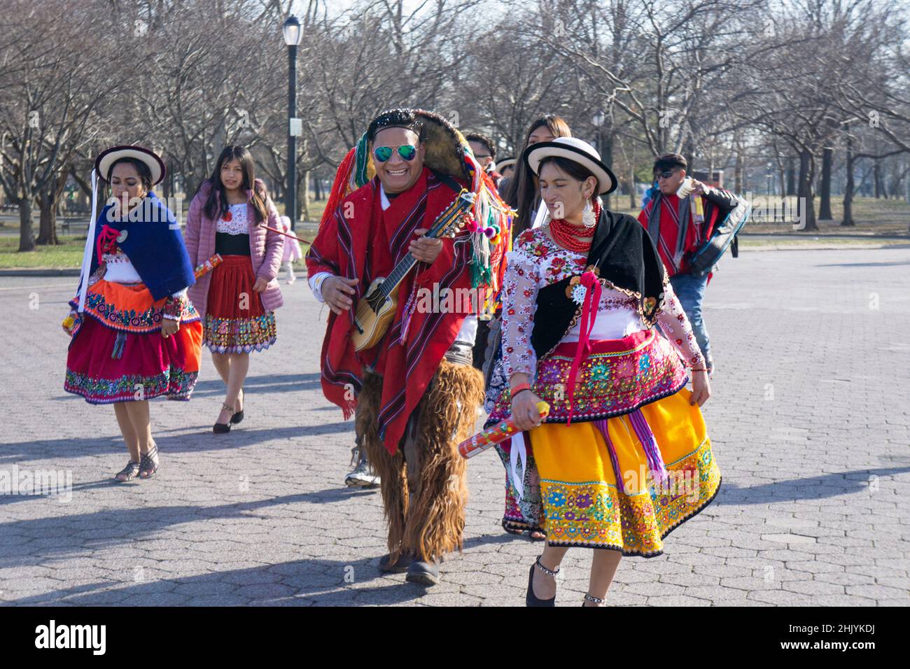 Ecuadorian dancers & musicians perform alongside the Unisphere for a video shoot of their group. In Queens, New York City. Stock Photo