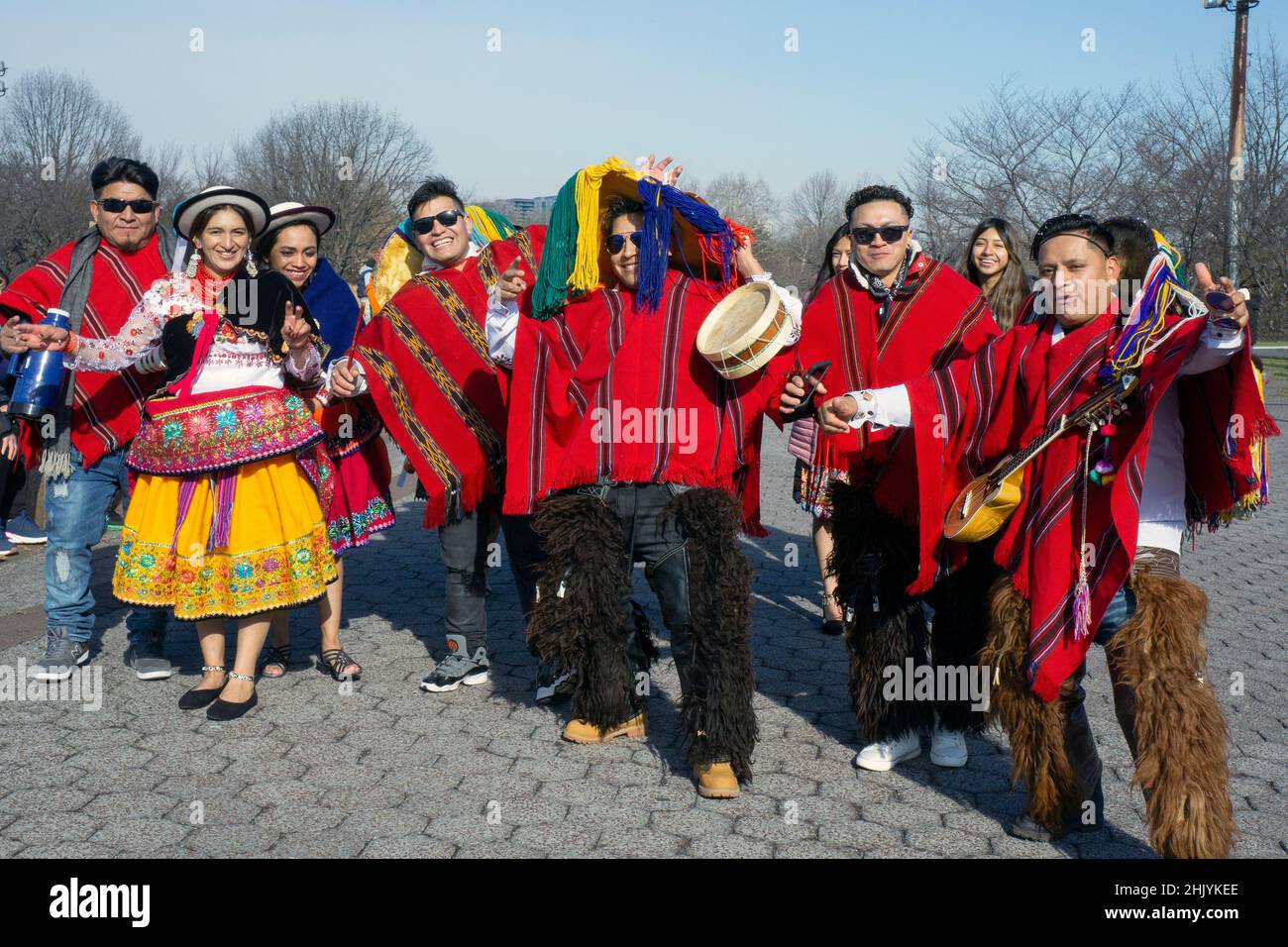 Posed group photo of Ecuadorian dancers & musicians at Flushing Meadows Corona park for a video shoot. In Queens, New York City, a very diverse place. Stock Photo