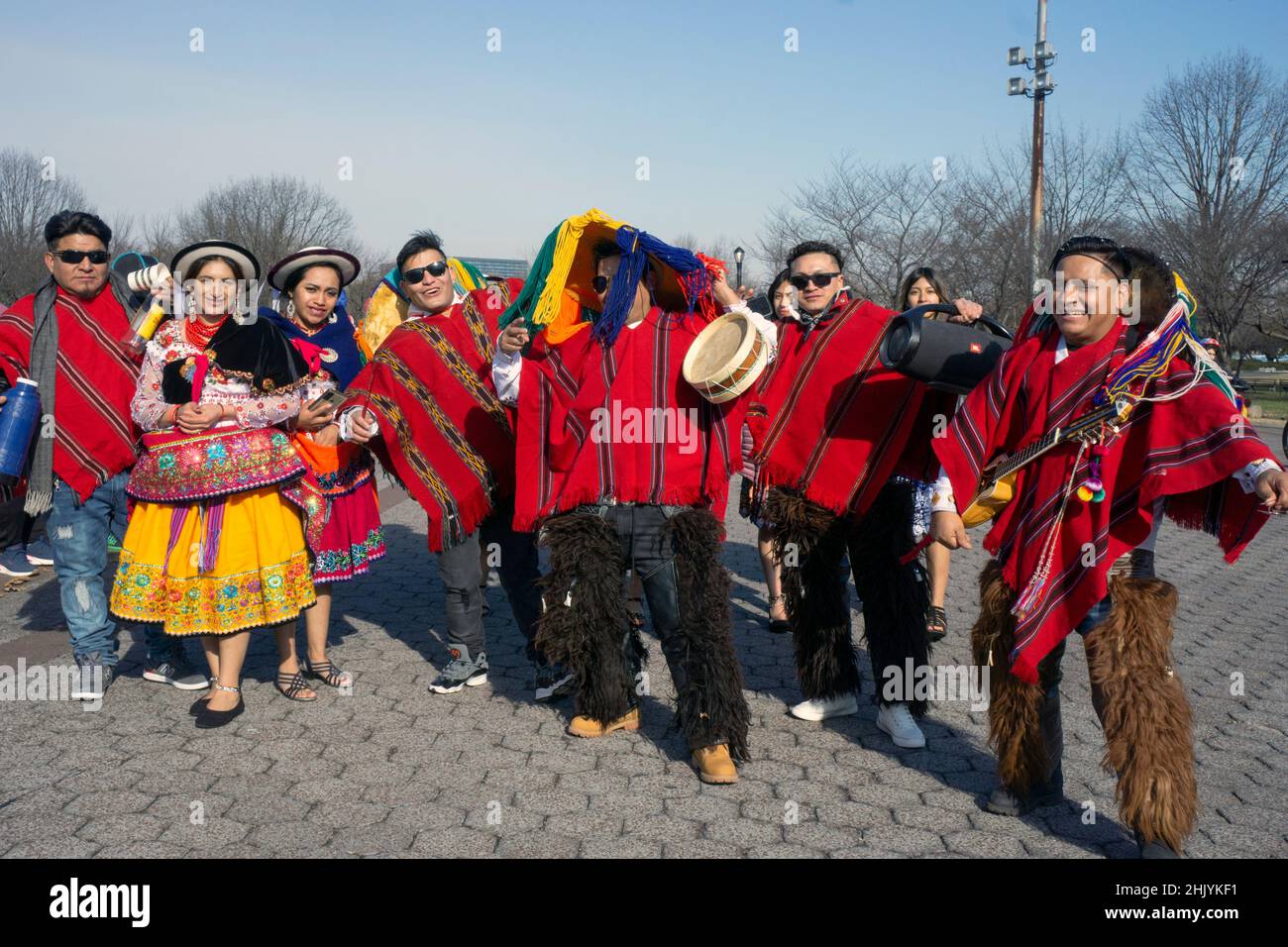 Posed group photo of Ecuadorian dancers & musicians at Flushing Meadows Corona park for a video shoot. In Queens, New York City, a very diverse place. Stock Photo