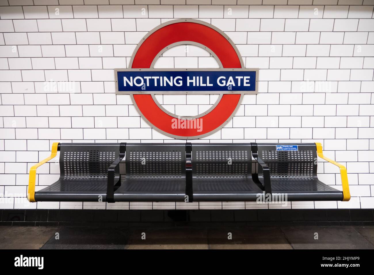 Notting Hill Gate tube station. The identifying roundel sign on the platform of a Central line London Underground public transport system station. Stock Photo