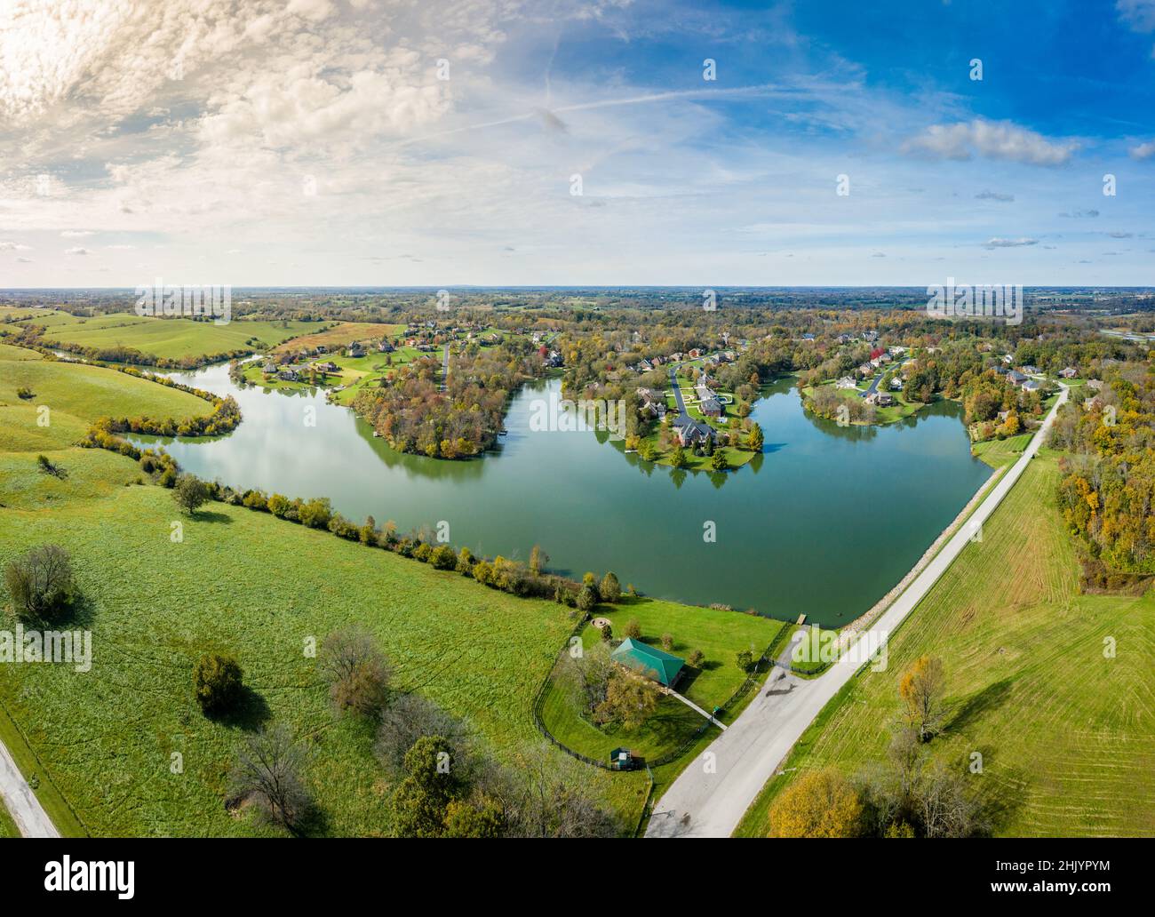 Aerial footage of residential subdivision by a lake in Central Kentucky in fall Stock Photo