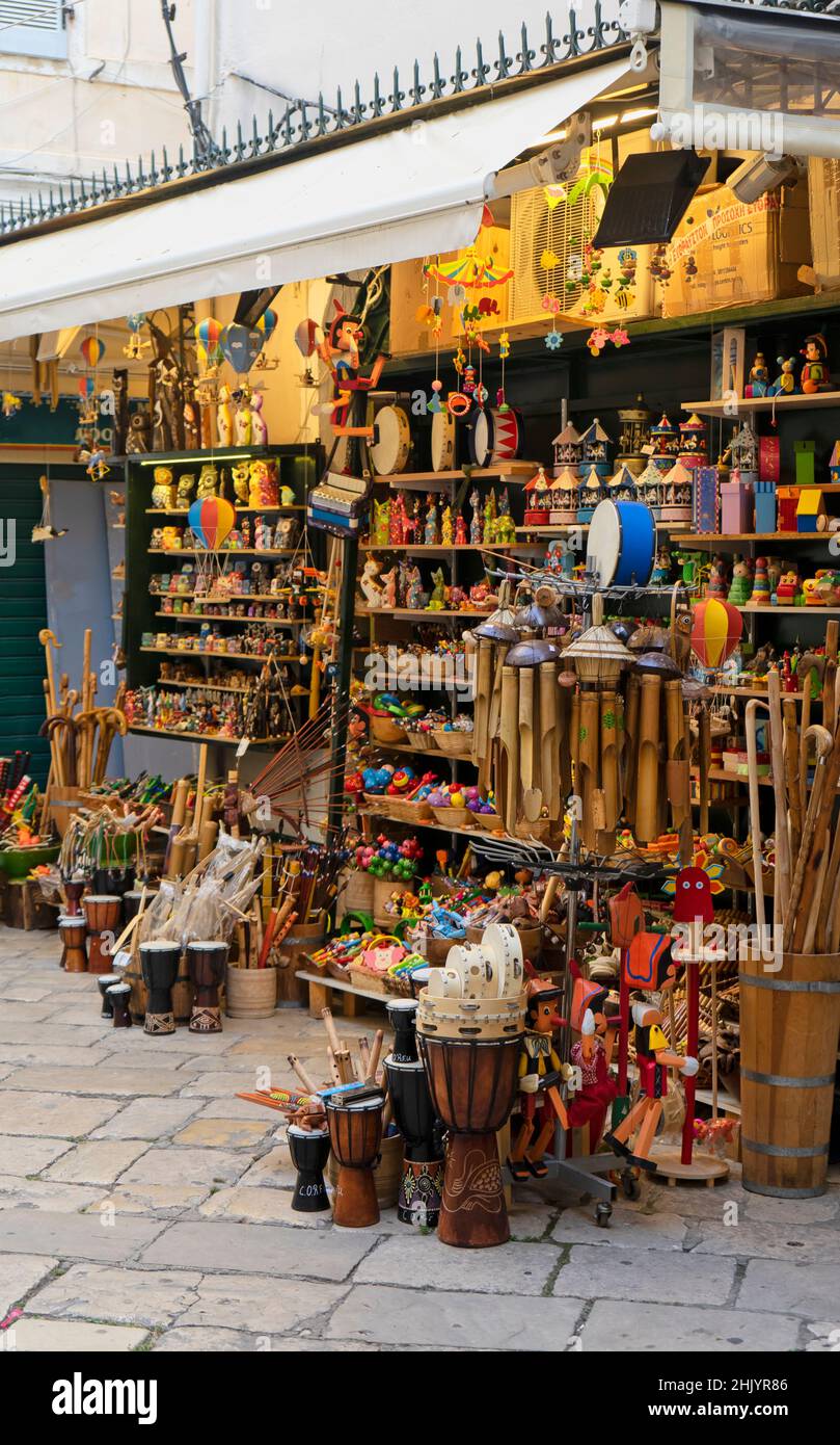 Traditional exhibition of toys and handicrafts in the historical center of Kerkira (Corfu) in Greece. Vertical Screen Stock Photo