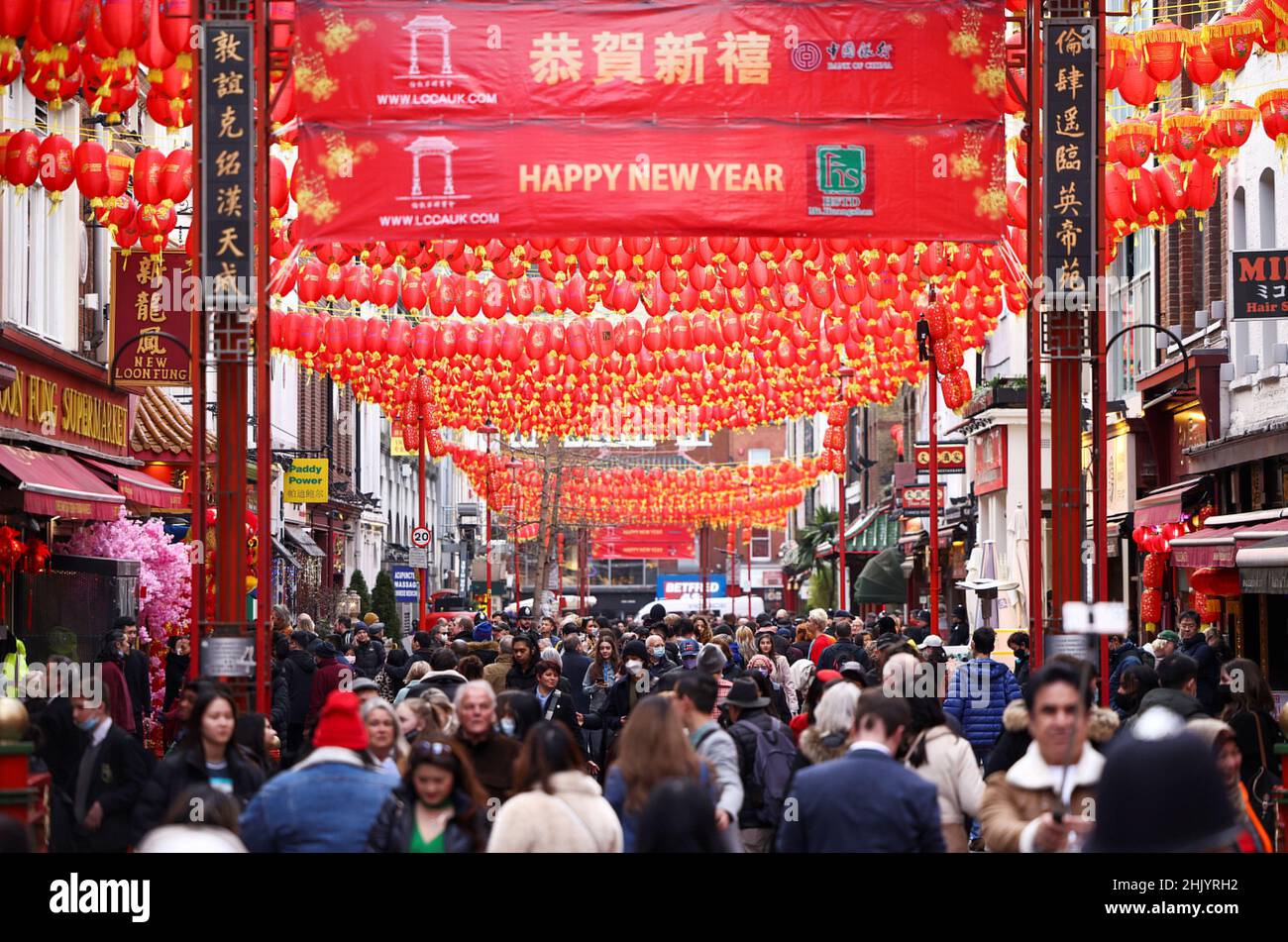 People walk through Chinatown during celebrations on the first day of the Lunar New Year in London, Britain, February 1, 2022. REUTERS/Henry Nicholls Stock Photo