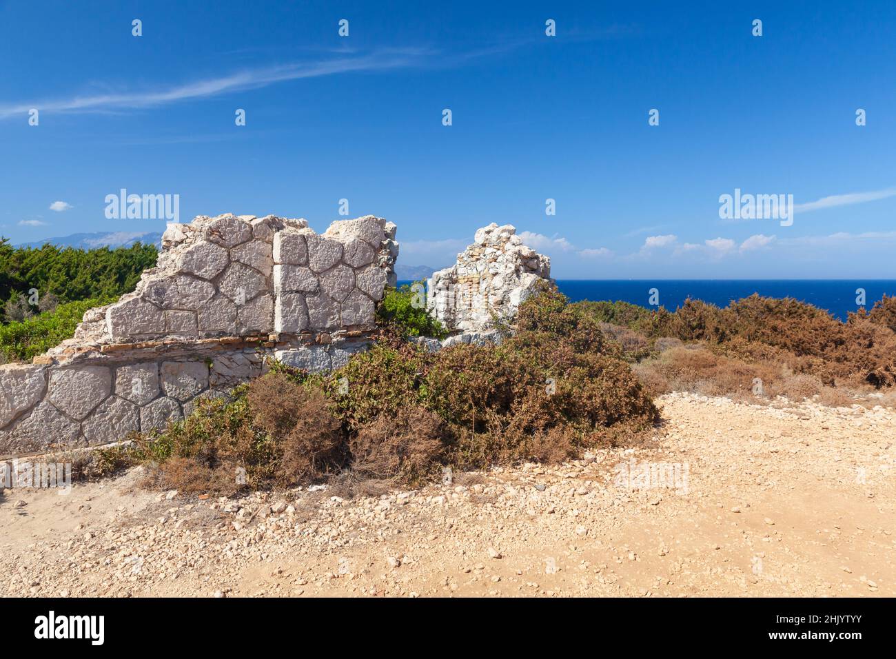 Rural summer landscape with ruins of an ancient stone house on a sunny day. Zakynthos, Greece Stock Photo