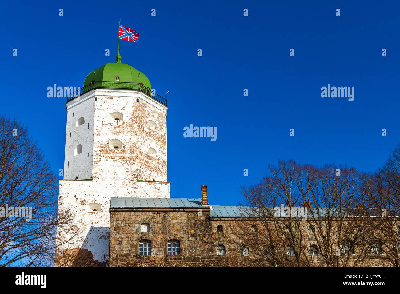 White tower of Vyborg Castle under blue sky on a sunny day. Russia Stock Photo