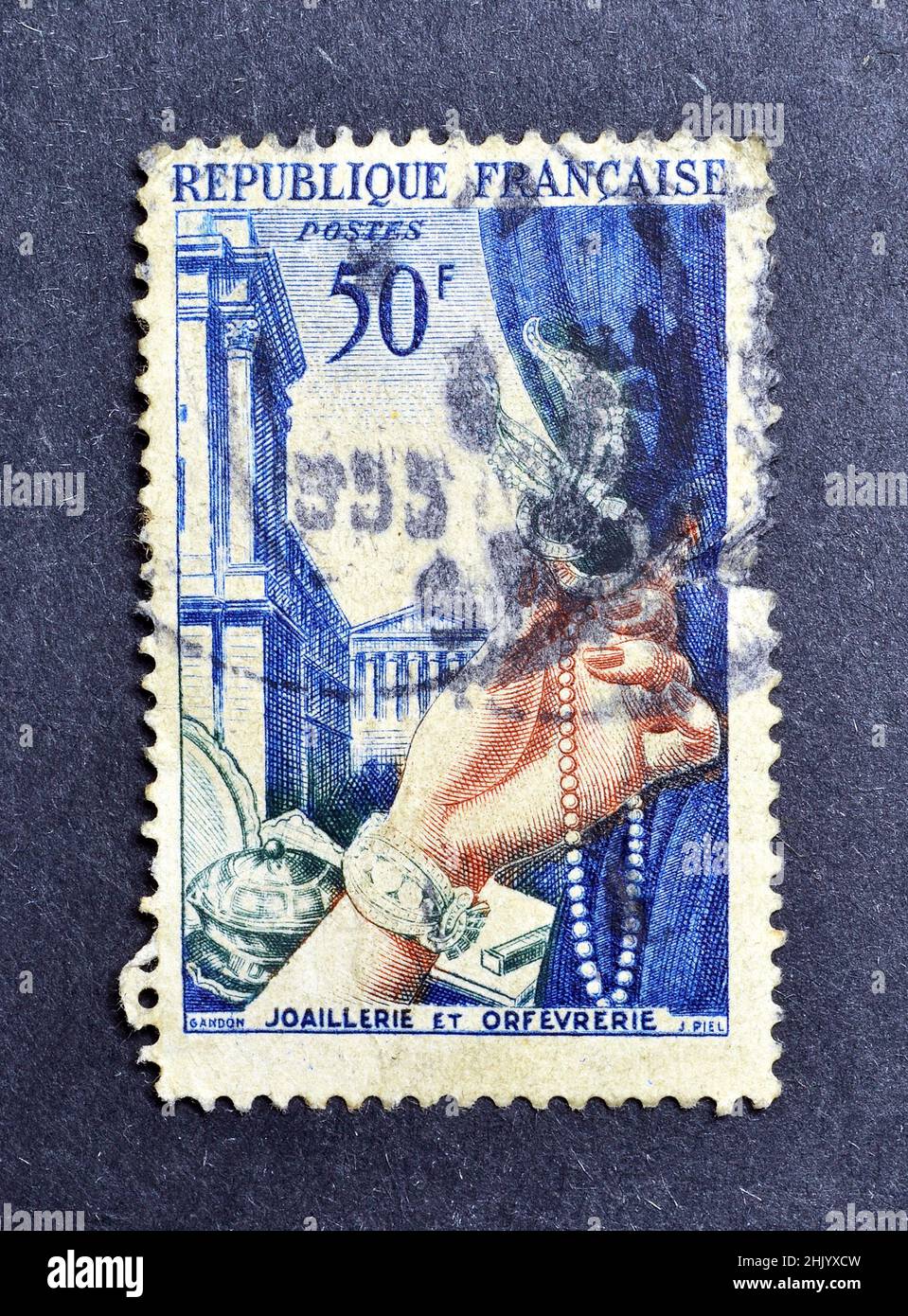 Cancelled potage stamp printed by France, that shows Gold Plate and