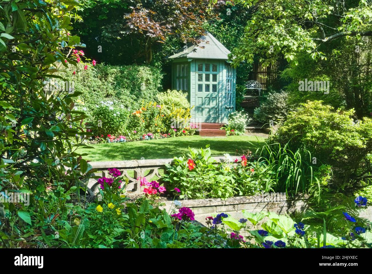 House Back garden with bespoke summerhouse and beautiful flower displays, design, Polmont, Falkirk, Central Scotland, UK Stock Photo