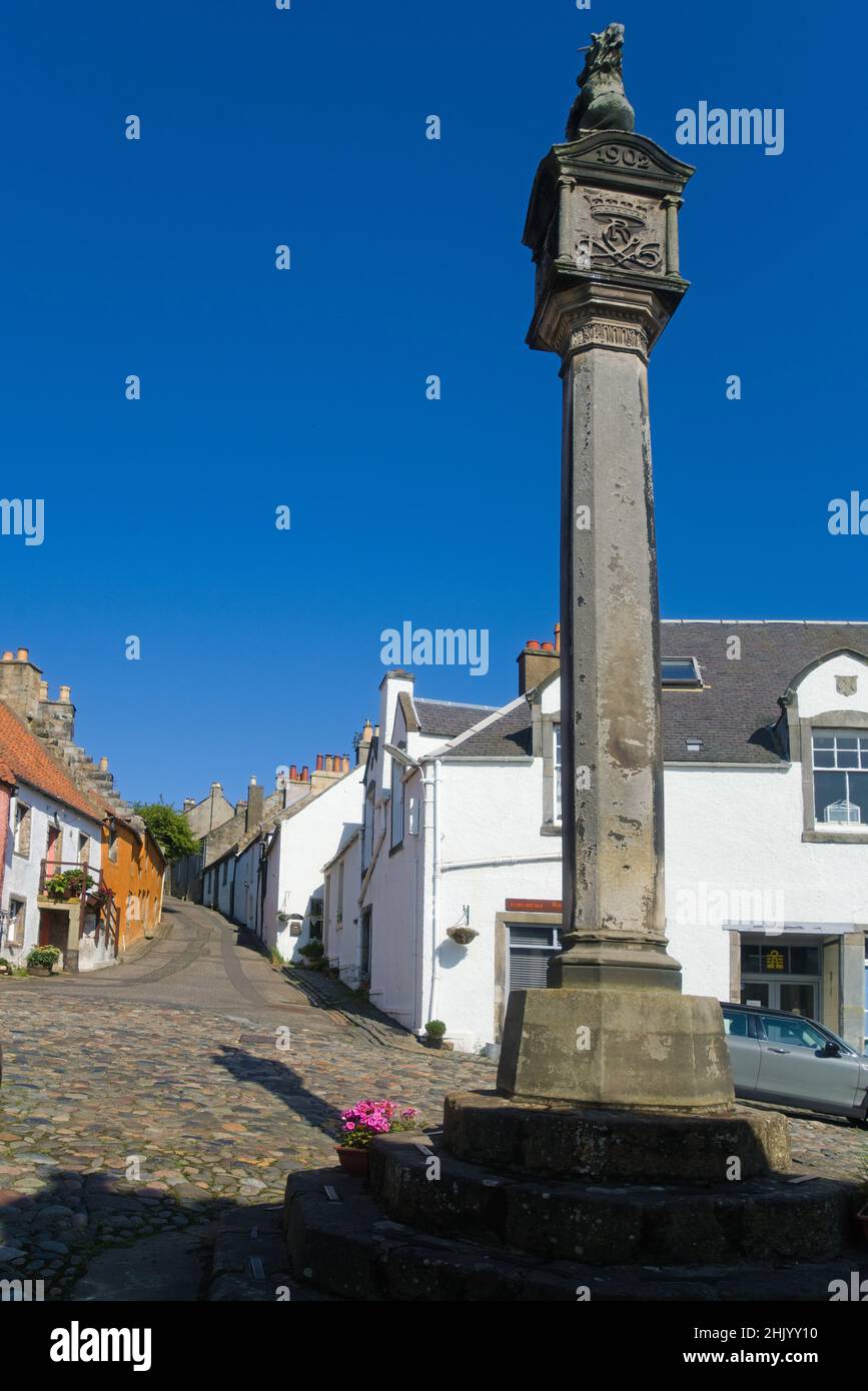 Ancient Culross village Mercat Cross. Showing some of the ancient buildings and stone cobbled streets.   Culross, Fife, Scotland, uk Stock Photo