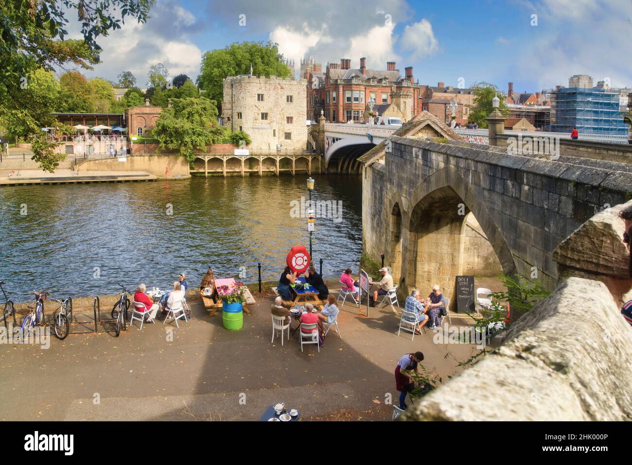 York. Looking across River Ouse to Lendal Bridge and tower. People ...