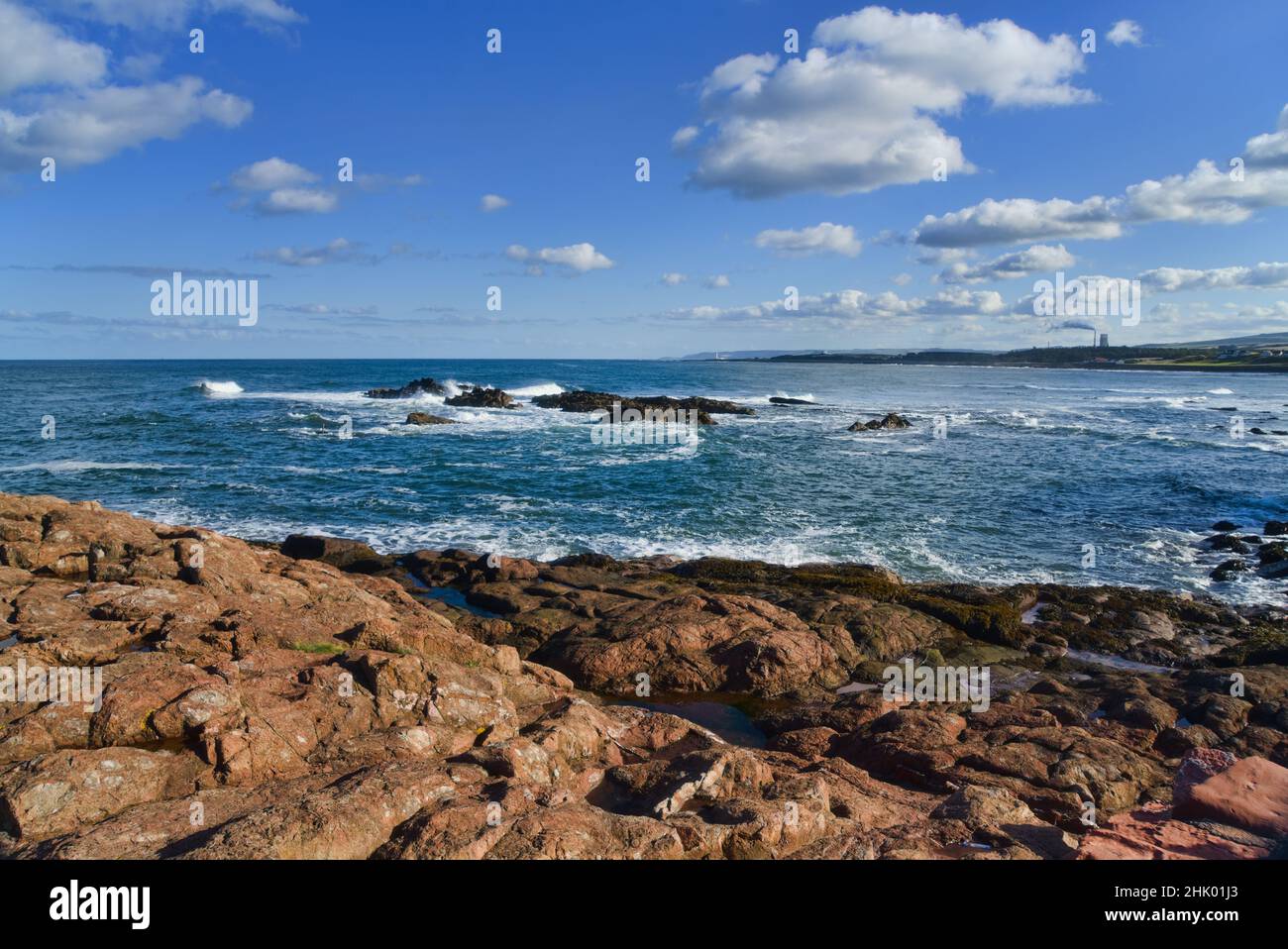 Looking east from Dunbar Harbour along East Lothian Coast towards Torness Nuclear Power Station.    East Lothian, Scotland, UK Stock Photo