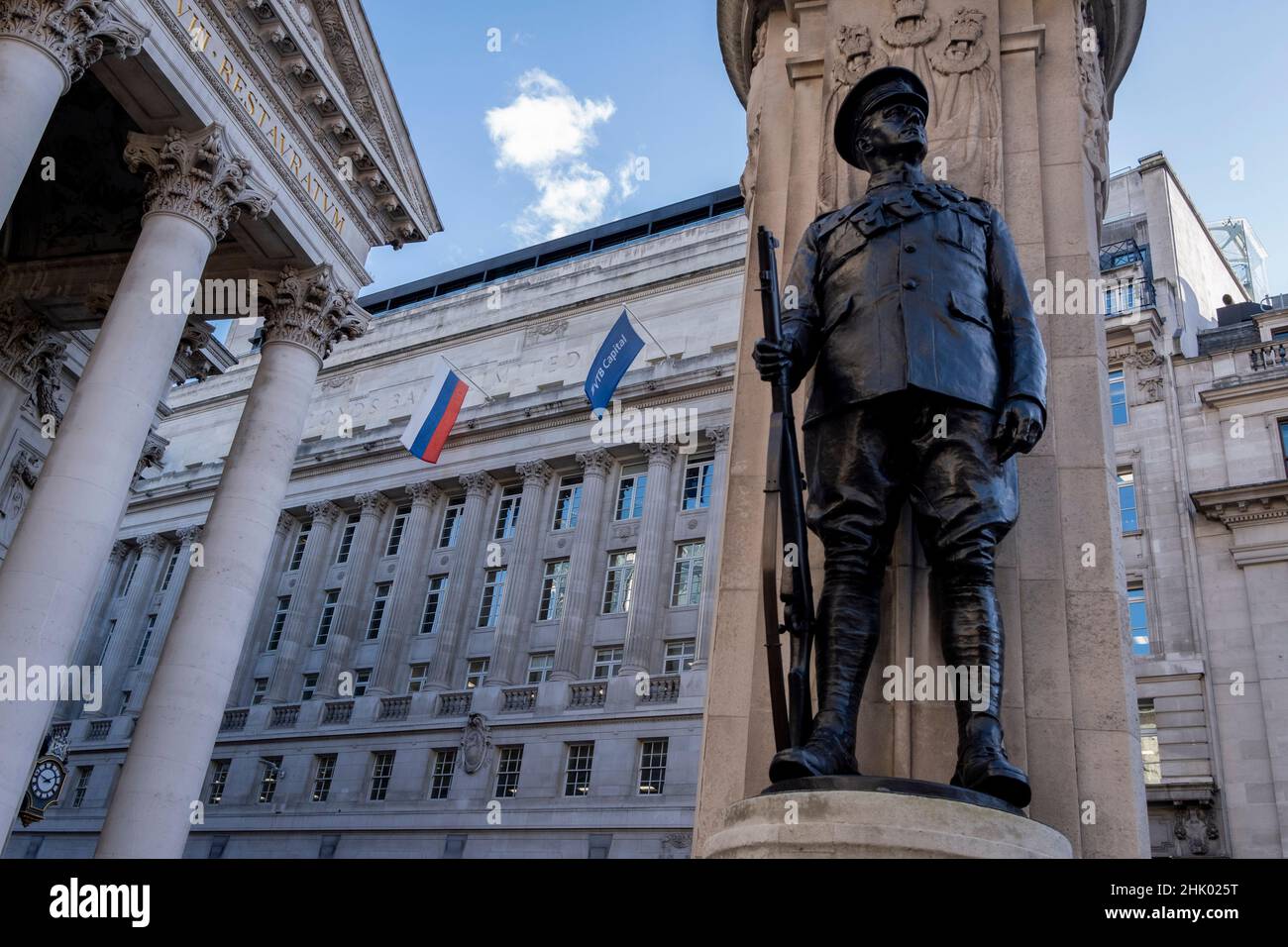 The Russian flag hangs from Russian Federation and Russian investment Bank VTB Capital, above the war memorial to WW1 British war dead and a day before Prime Minister Boris Johnson flies to Ukraine. Amid tensions between Ukraine and Russia, the British government is again threatening economic sanctions on Russian president Putin-friendly oligarchs who, it is believed, launder their ‘dirty money’, on 31st January 2022, in the City of London, England. Campaign group 'Transparency International' say an estimated £1.5bn of UK property has been spent with suspect funds from Russia, via the City of Stock Photo