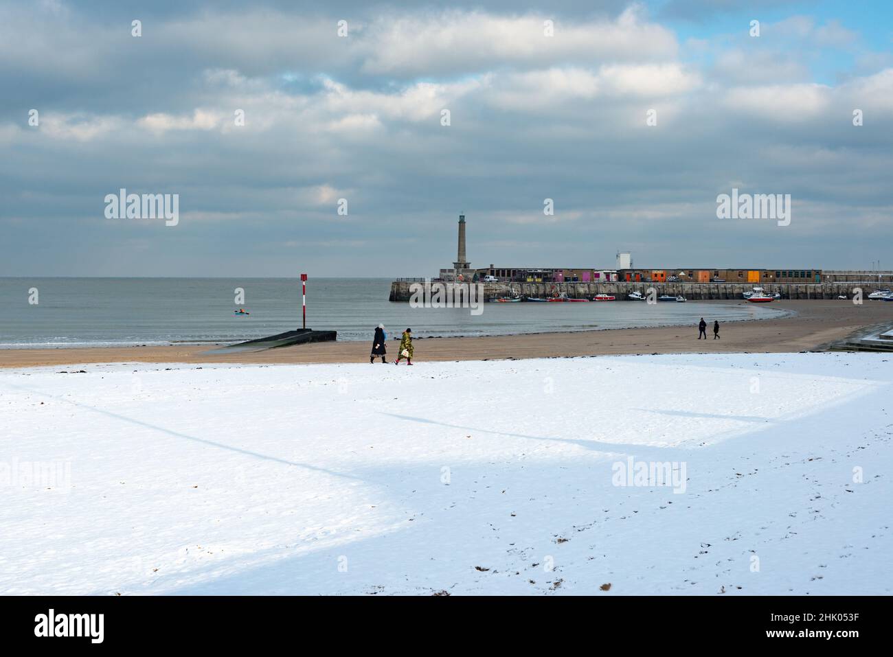 The Harbour Arm and Margate Main Sands in the snow, Margate, Kent, UK Stock Photo