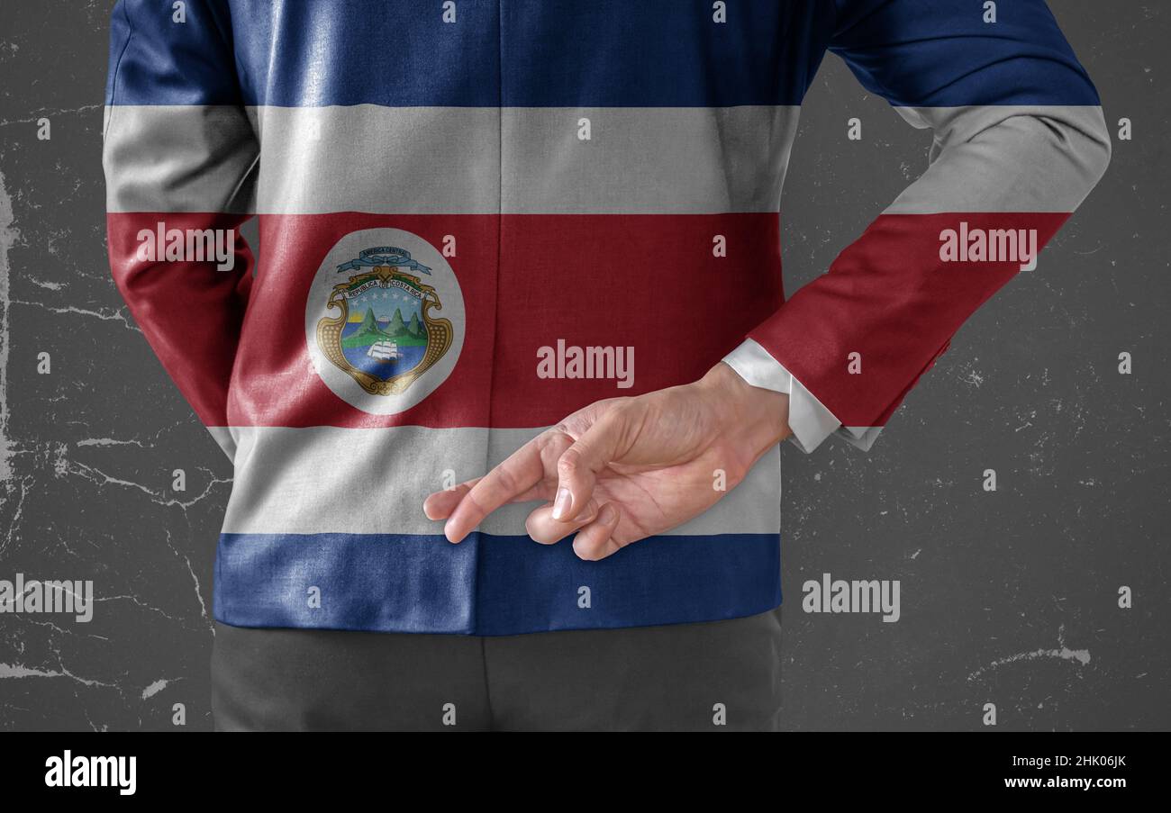 Businessman Jacket with Flag of Costa Rica with his fingers crossed
