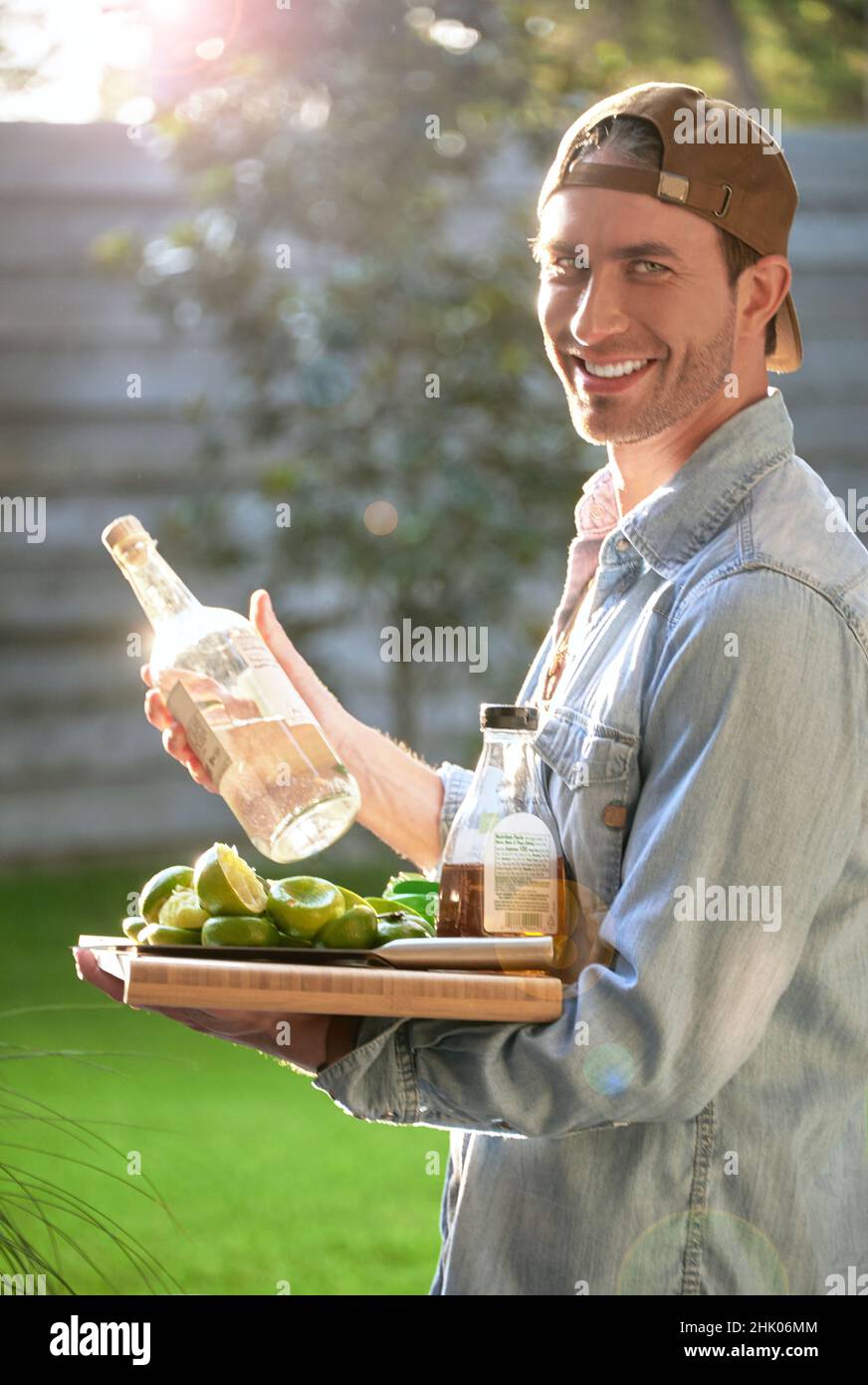 Male Model Serving Margaritas Poolside Stock Photo