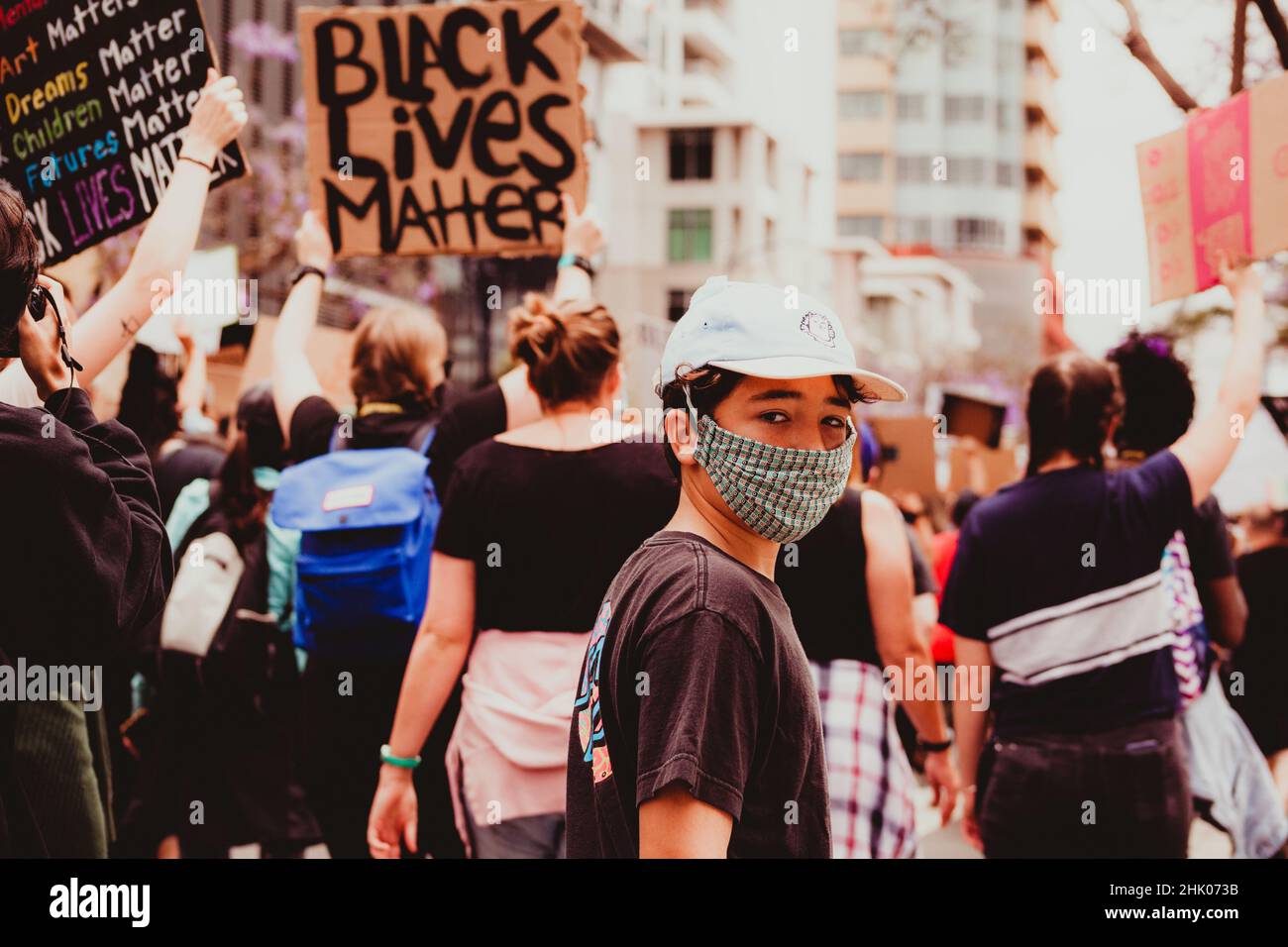 Pre-teen boy walking at a Black Lives Matter march Stock Photo - Alamy