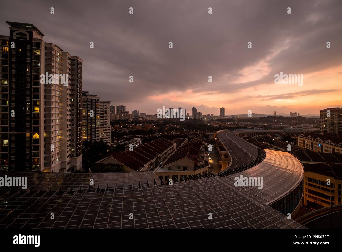 Kuala Lumpur, Malaysia: 2022: View over Kuala Lumpur at dusk from Damansara Perdana residential building, with the new DASH high way in foreground Stock Photo