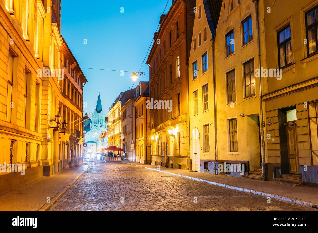 Riga Latvia. The White Tower With Pyramidal Spire Of Our Lady Of Sorrows Or Virgin Of Anguish Church, Ancient Catholic Church On Pils Street In Stock Photo