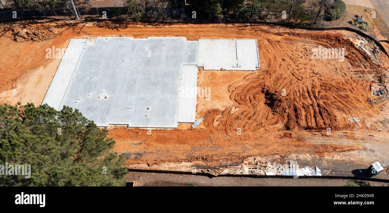 Concrete slab on dirt lot for new home construction Stock Photo