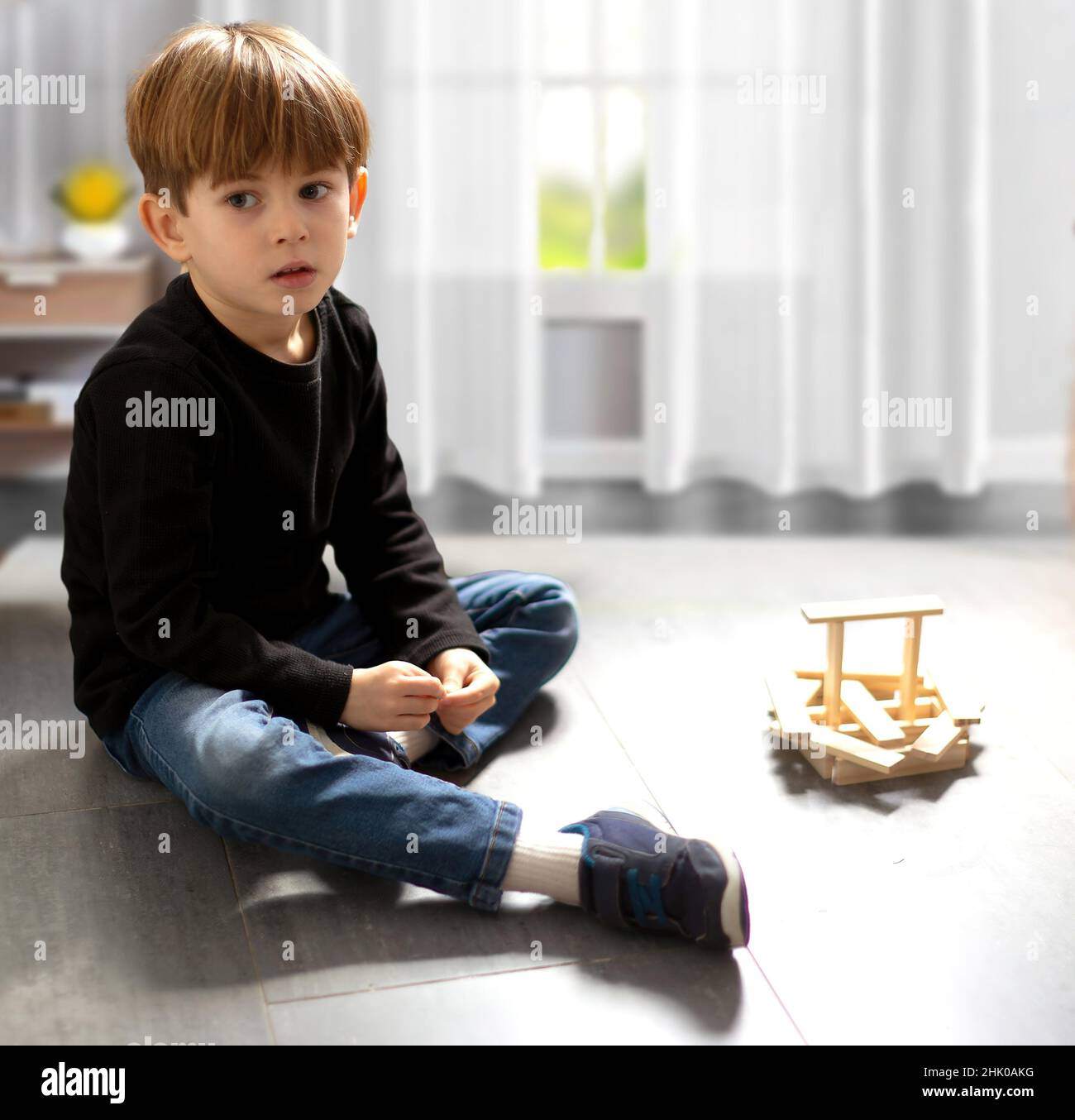 Expressive child playing in his room. Stock Photo
