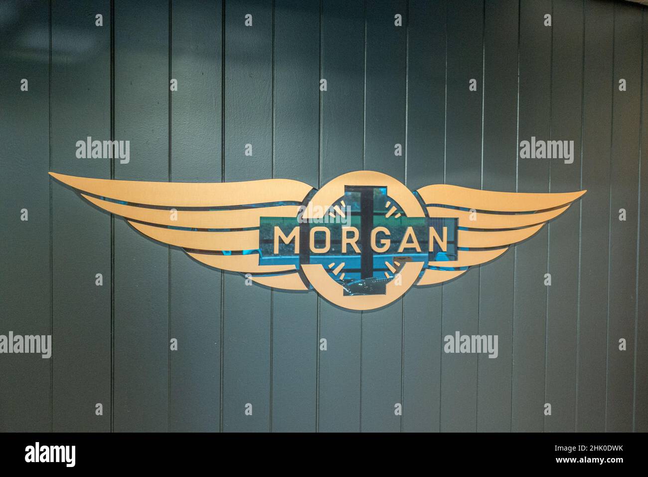 Logo of Morgan cars on the wall of their showroom Malvern Link, Worcestershire Stock Photo