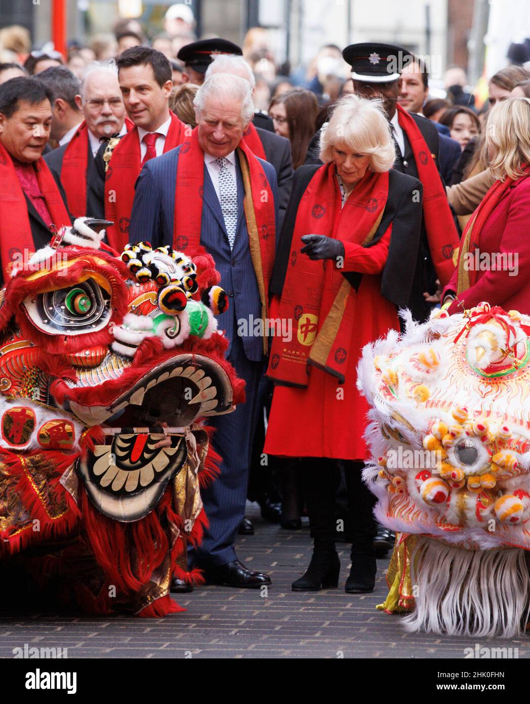 London, UK. 1st Feb, 2022. Prince Charles and Camilla, Duchess of Cornwall, don red scarves as they visit Chinatown to celebrate the Chinese Lunar New Year which begins on February 1st. It is the year of the Tiger. Credit: Mark Thomas/Alamy Live News Stock Photo