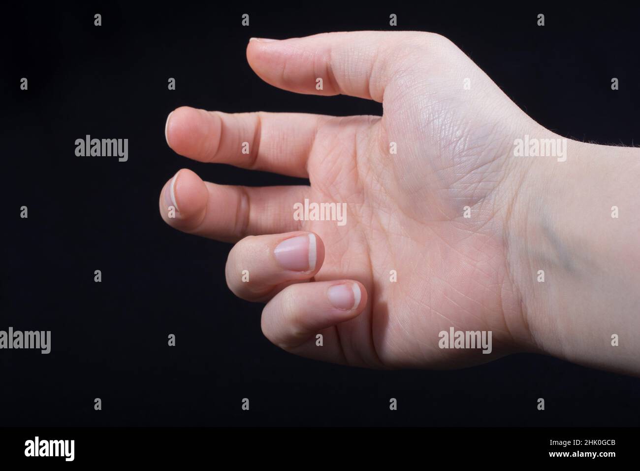 Five Fingers Of A Child Hand Partly Seen In Black Background Stock 