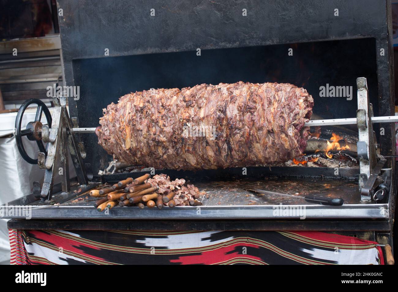 Turkish cag Kebab on pole in horizontal position. Stock Photo