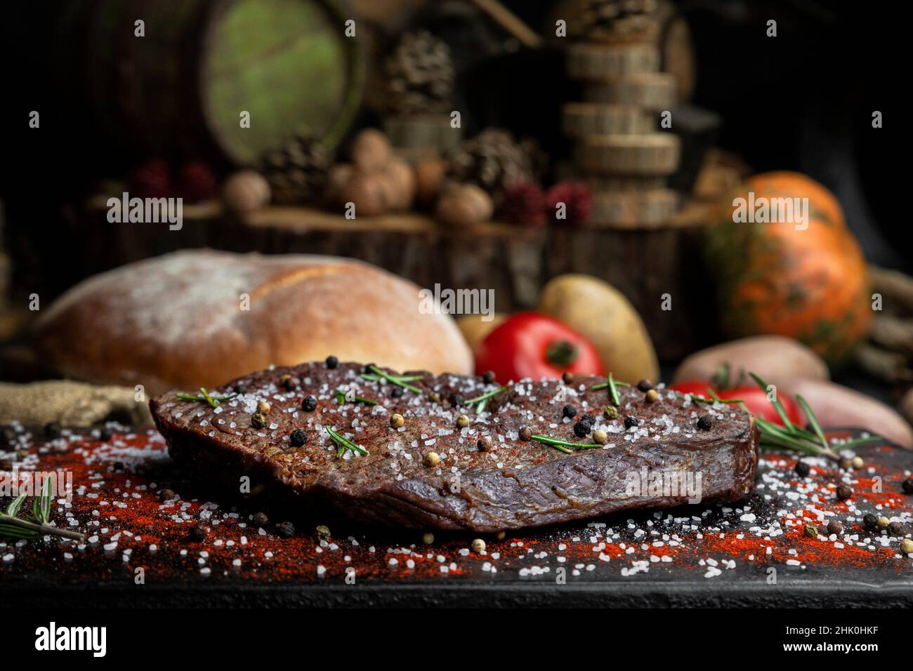 Beef steak seasoned with salt, pepper and fresh hearbs searved in the