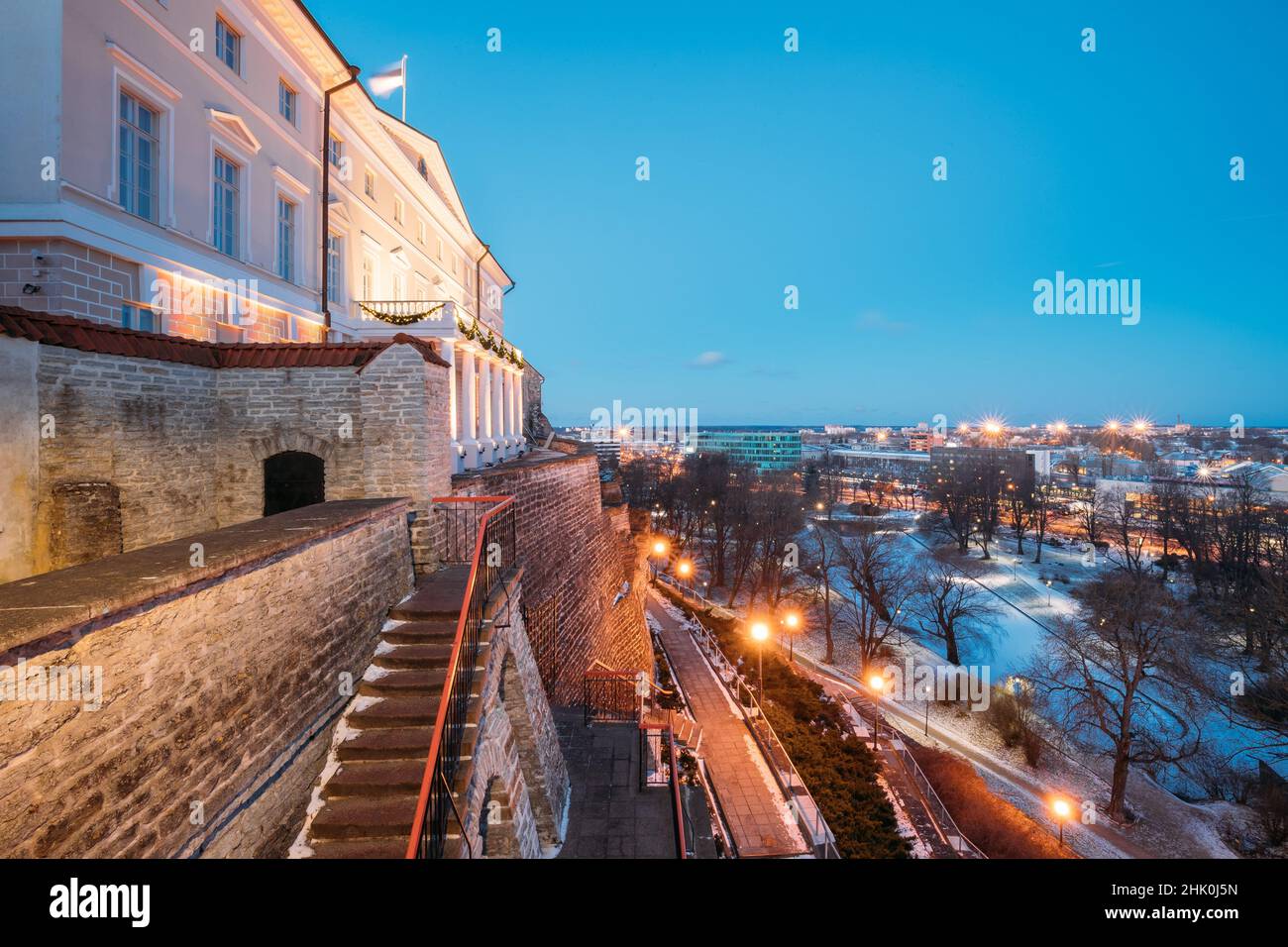 Tallinn, Estonia. Building Of Government Of Republic Of Estonia, Old Stone Staircase And Cityscape At Winter Evening Night. View From Patkuli Stock Photo