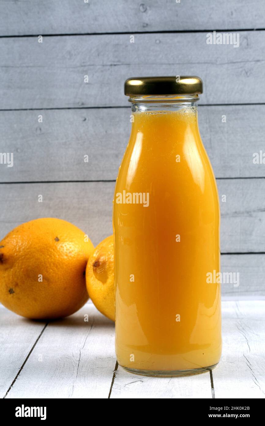 Bottled orange juice with lemons Stock Photo Alamy