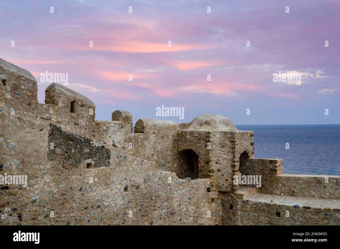 Defensive Walls in Monemvasia Island, Peloponnese, Greece at Sunset. Medieval Castle Town Ends by the Sea. Stock Photo